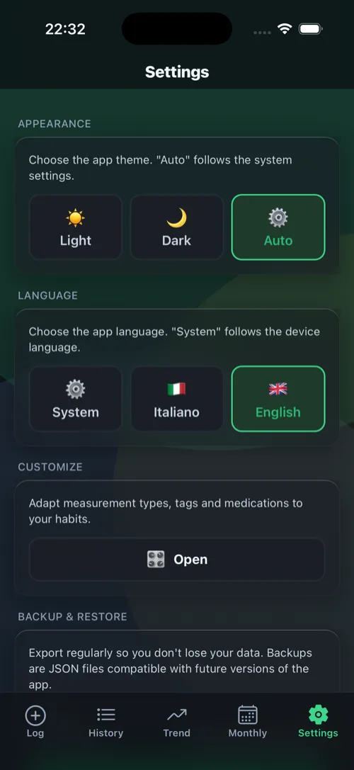 Settings screen: light/dark theme, language and encrypted backup.